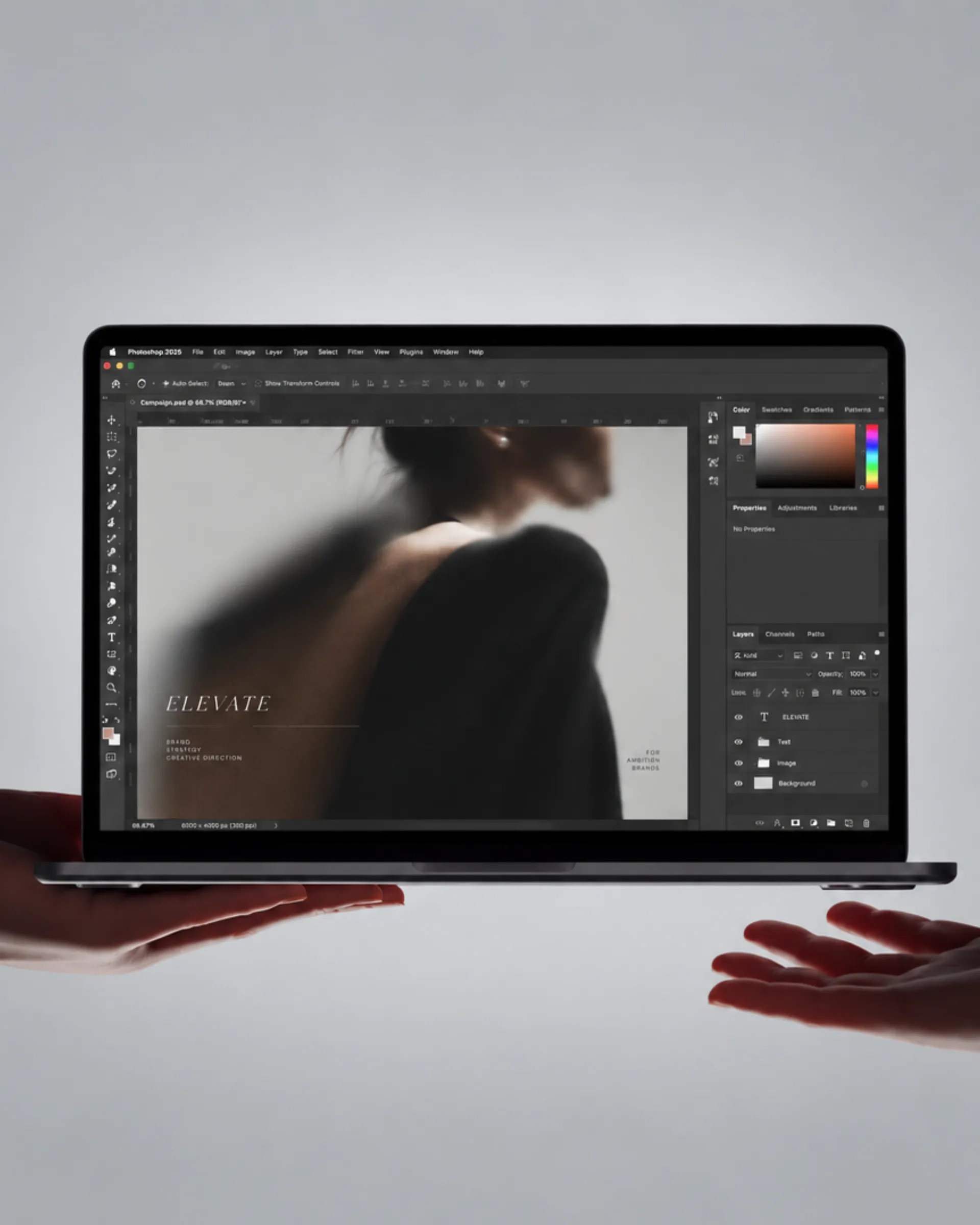 Brand identity materials laid out on a dark slate surface